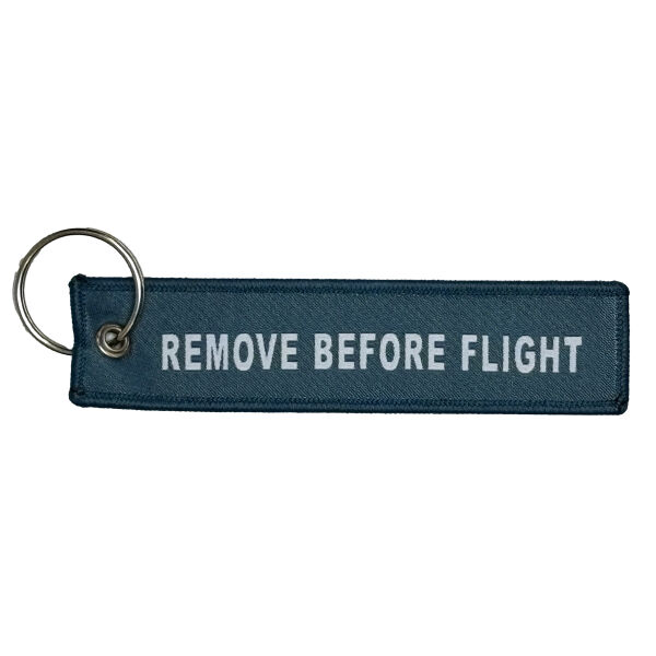 Geweven remove before flight sleutelhanger Geweven remove before flight sleutelhanger