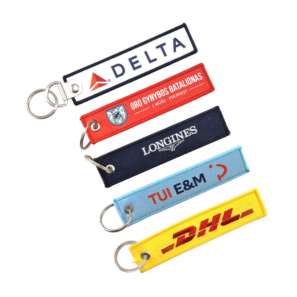 Geweven remove before flight sleutelhanger Geweven remove before flight sleutelhanger